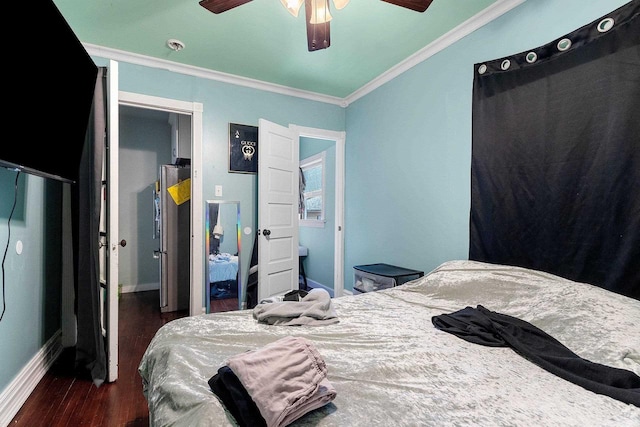 bedroom with dark wood-style floors, baseboards, ornamental molding, and ceiling fan