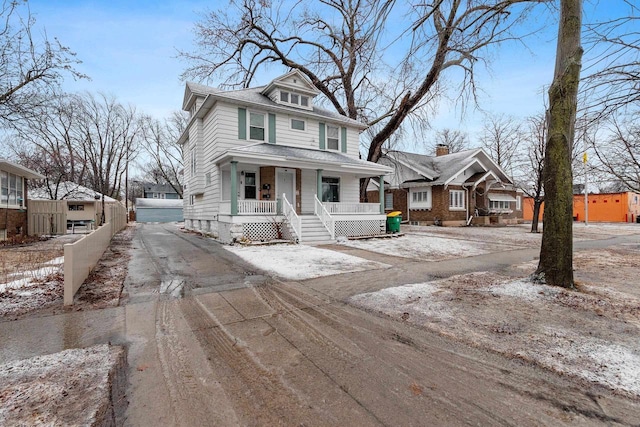 traditional style home featuring fence and a porch