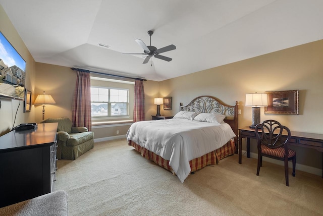 bedroom featuring vaulted ceiling, baseboards, visible vents, and light colored carpet