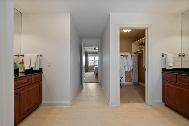 hallway featuring baseboards