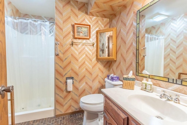 full bath featuring toilet, a shower stall, and vanity