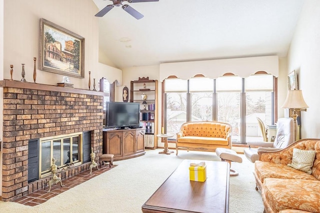 living area featuring a ceiling fan, lofted ceiling, carpet flooring, and a fireplace