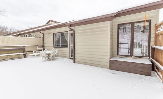 view of snow covered house