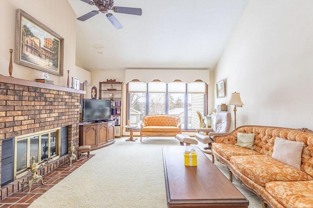 living area featuring lofted ceiling, dark carpet, ceiling fan, and a fireplace