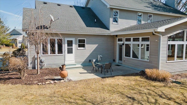 back of property featuring a patio area, a lawn, entry steps, and roof with shingles