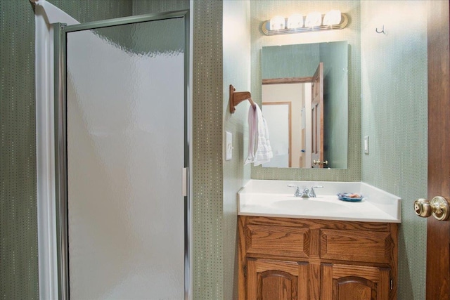 bathroom with vanity and a shower stall