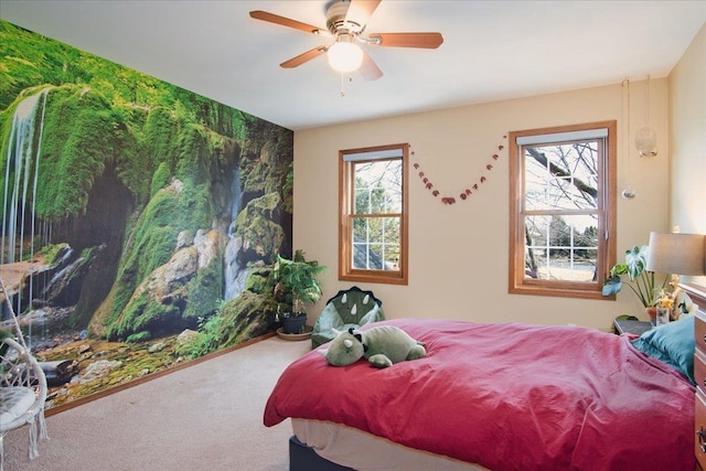 carpeted bedroom featuring a ceiling fan