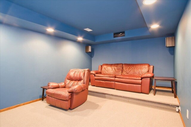 cinema with a tray ceiling, recessed lighting, carpet, and baseboards