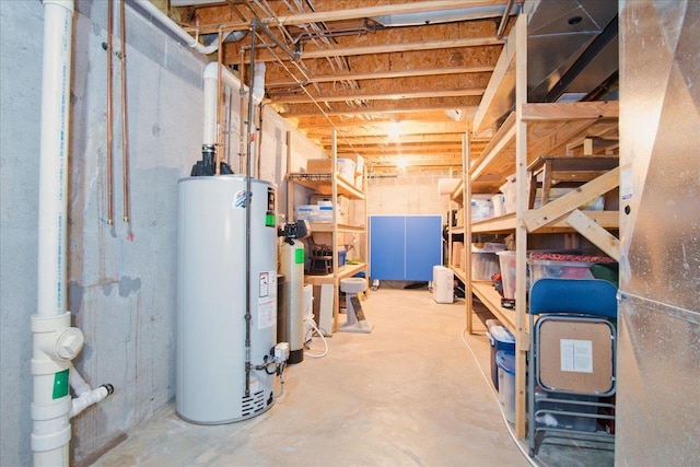 unfinished basement featuring water heater