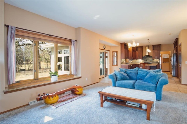 living area with light tile patterned floors, baseboards, and a chandelier