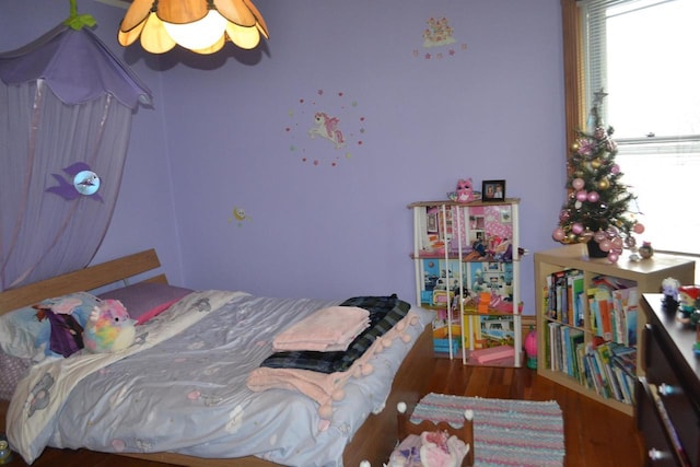 bedroom with wood finished floors