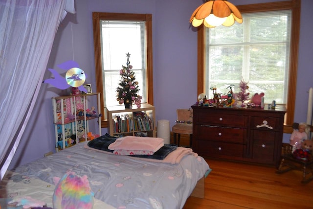 bedroom with wood finished floors