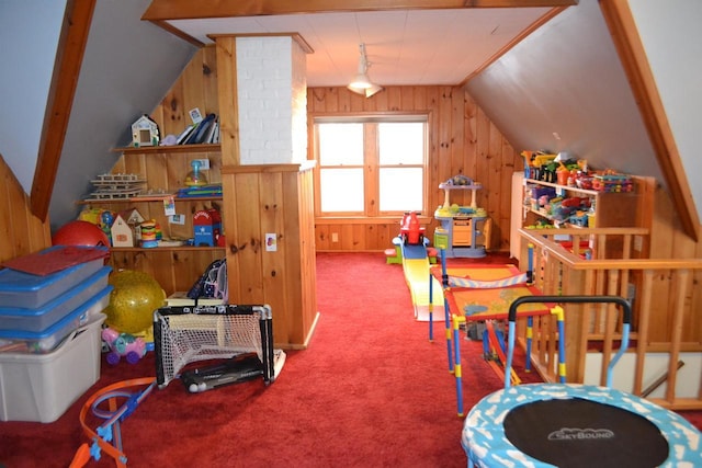 playroom with lofted ceiling, wooden walls, and carpet flooring