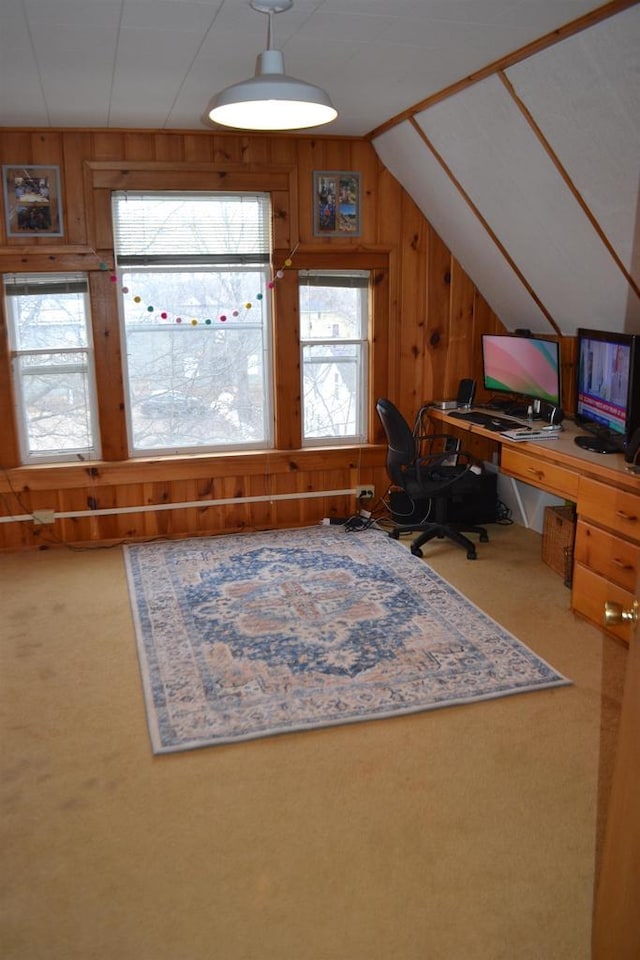 unfurnished office with lofted ceiling, wood walls, and carpet flooring