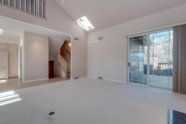 living area featuring stairs and visible vents