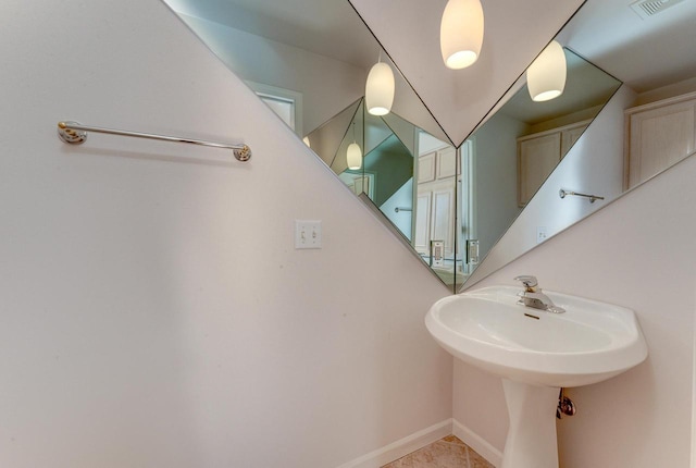 bathroom featuring baseboards