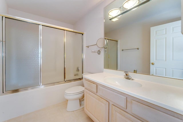 full bath featuring tile patterned floors, bath / shower combo with glass door, vanity, and toilet