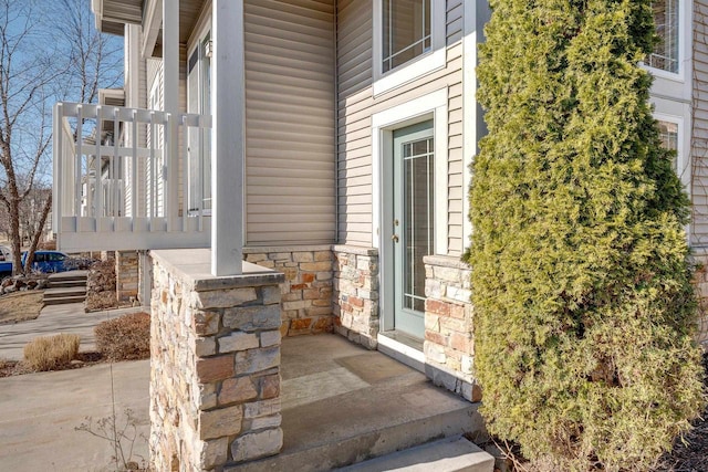 view of exterior entry with stone siding