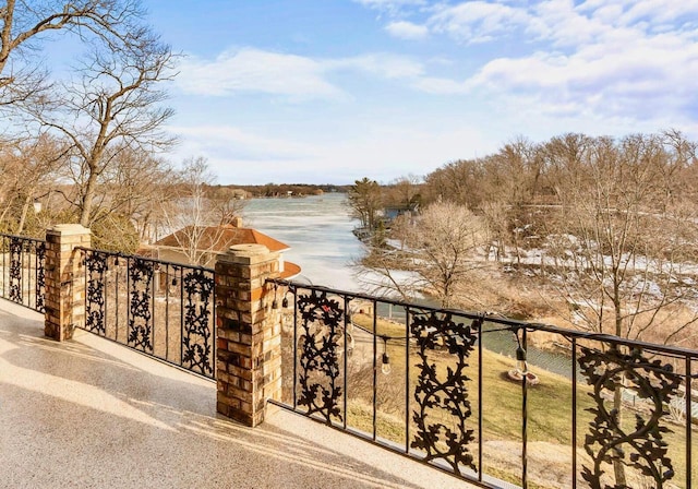 balcony featuring a water view