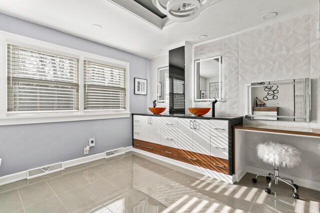 tiled bedroom with visible vents and baseboards