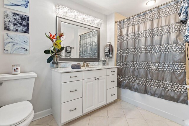 full bath featuring baseboards, curtained shower, toilet, and tile patterned floors