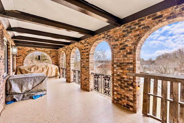 view of patio featuring a balcony