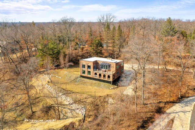 aerial view with a wooded view