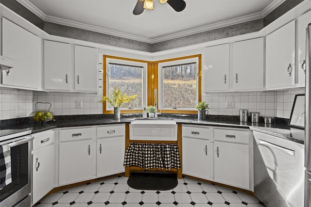 kitchen featuring stainless steel electric range oven, crown molding, light floors, and white cabinets