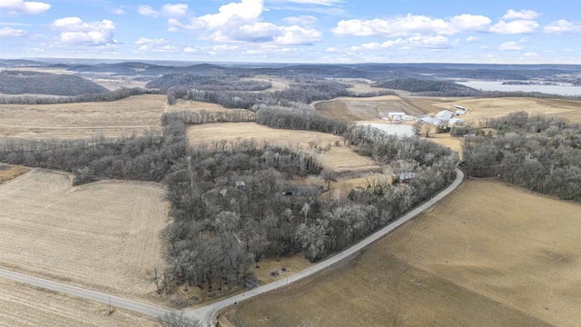 birds eye view of property with a rural view