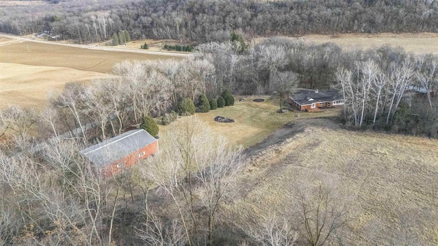 drone / aerial view with a view of trees and a rural view