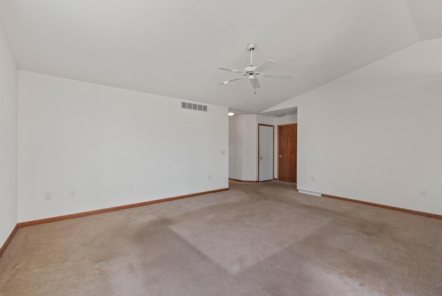 unfurnished room featuring visible vents, baseboards, ceiling fan, and vaulted ceiling