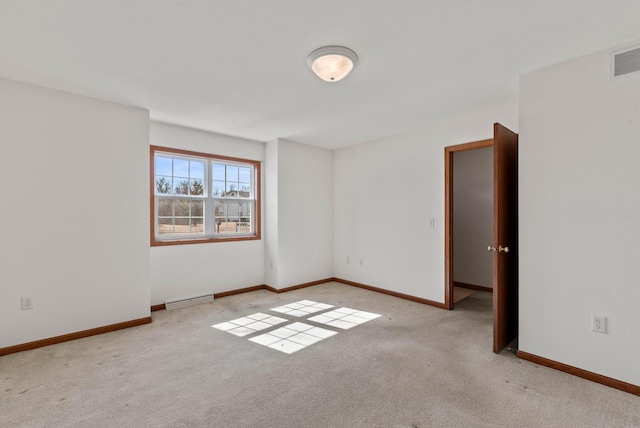 unfurnished room featuring visible vents, baseboards, and carpet floors