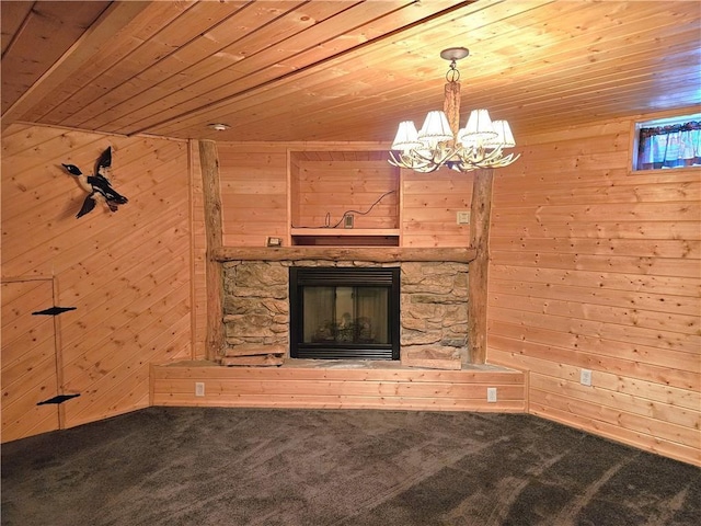 unfurnished living room with wooden ceiling, a fireplace, and wooden walls