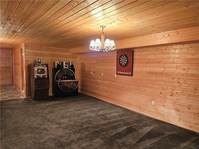 interior space with dark colored carpet, wood walls, wooden ceiling, and a notable chandelier