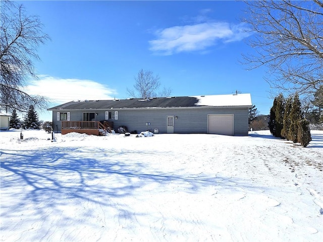 view of front of property featuring a garage and a deck