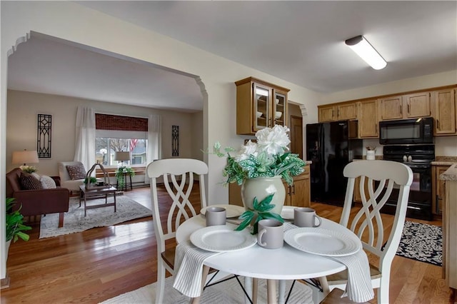 dining space with light wood-type flooring