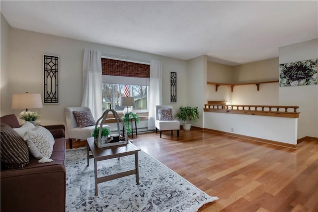 living room featuring baseboards and wood finished floors