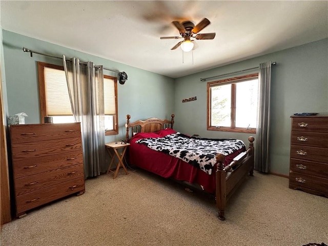 bedroom featuring light carpet and ceiling fan