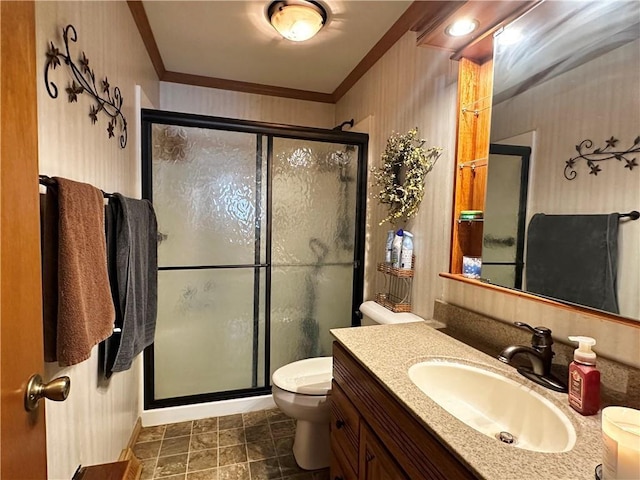 bathroom with wallpapered walls, toilet, crown molding, vanity, and a shower stall