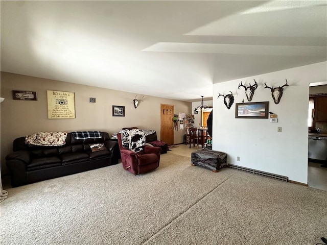 carpeted living area featuring baseboard heating and baseboards