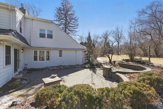 exterior space featuring entry steps and a patio