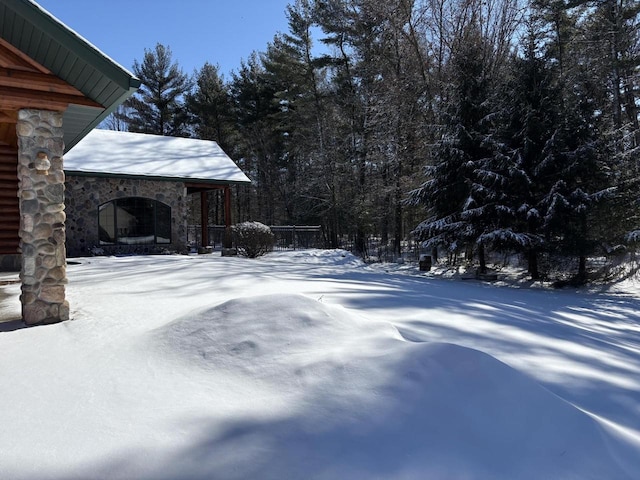 view of yard layered in snow