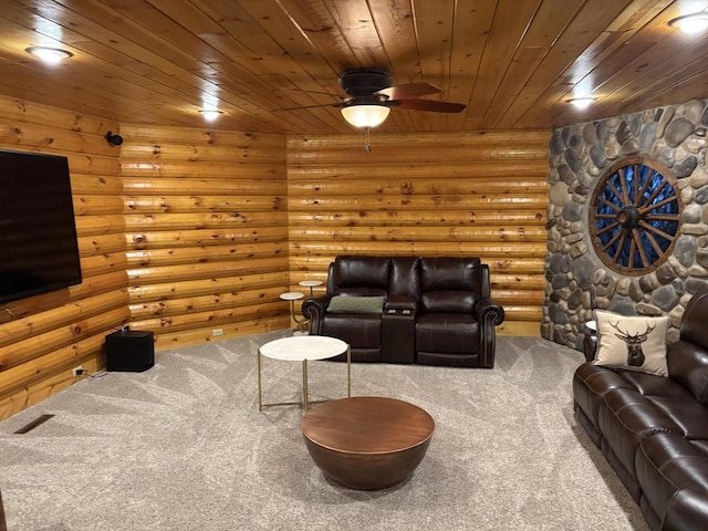 carpeted living room with wooden ceiling, log walls, and a ceiling fan