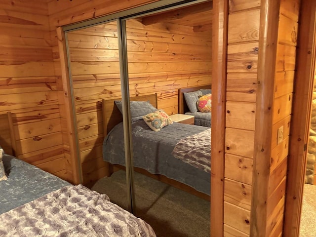 bedroom with wooden walls