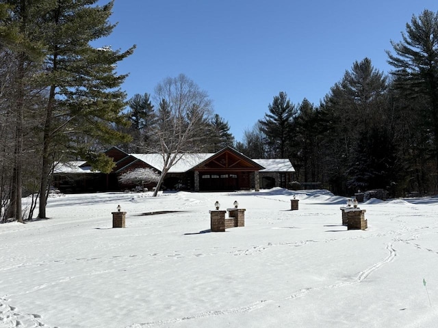 view of yard layered in snow