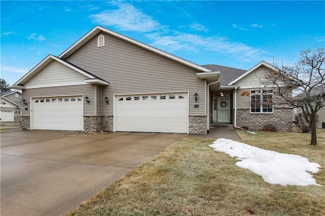 single story home featuring stone siding, an attached garage, driveway, and a front yard