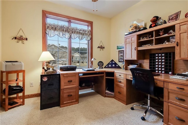 home office featuring ceiling fan and baseboards