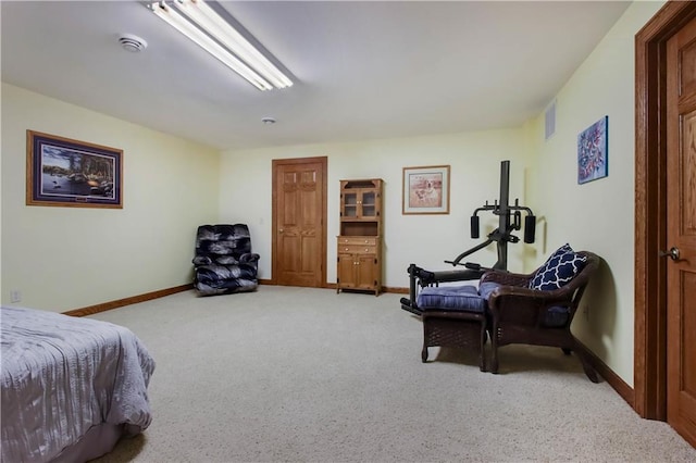 bedroom featuring visible vents, baseboards, and light colored carpet