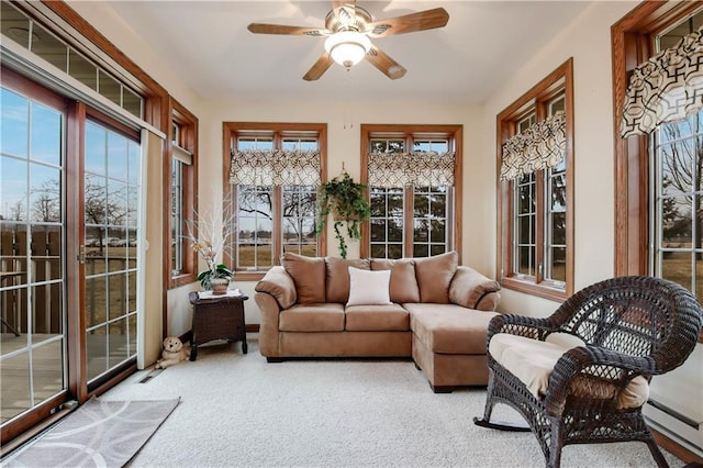 sunroom featuring ceiling fan