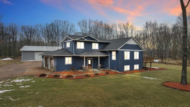 view of front of home with a yard, central AC unit, roof with shingles, and driveway